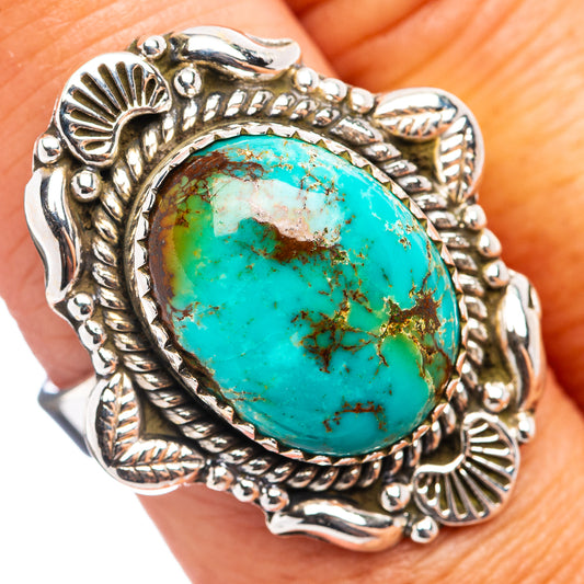 Sterling silver ring with oval turquoise cabochon and ornate bezel
