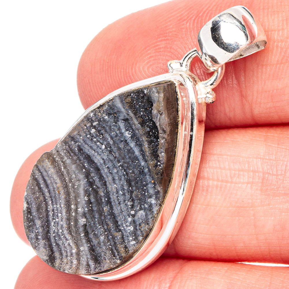 Sterling silver druzy pendant with dark blue-gray teardrop stone, ridged bezel