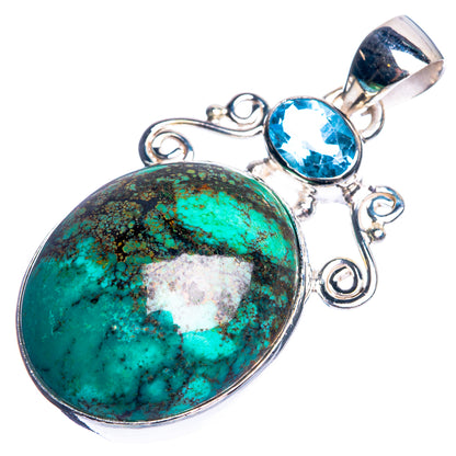 Sterling silver pendant with large oval turquoise cabochon and oval blue gemstone, bail top