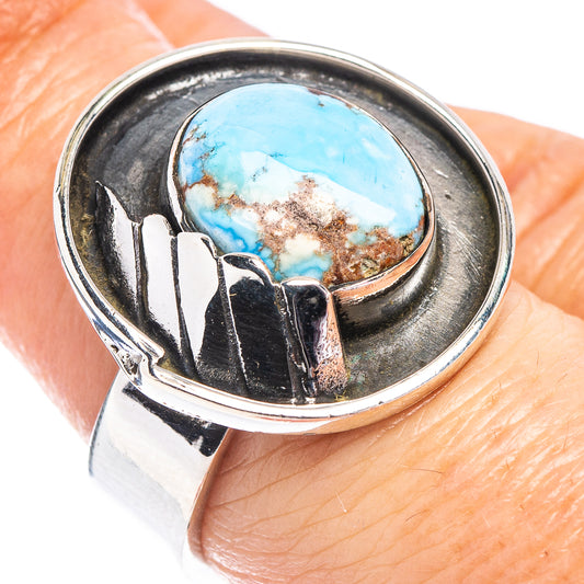 Sterling silver adjustable ring with oval turquoise cabochon and eagle-style cutwork