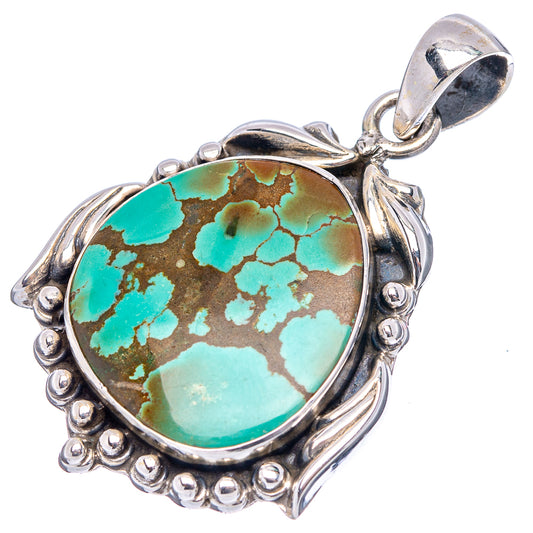Oval turquoise cabochon pendant in ornate .925 sterling silver frame with bail