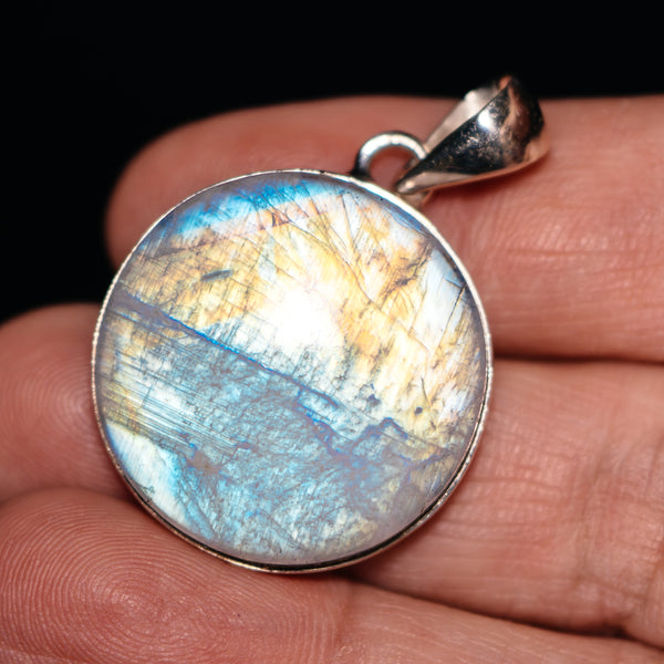 Round .925 sterling silver moonstone pendant with blue-gold rainbow flash