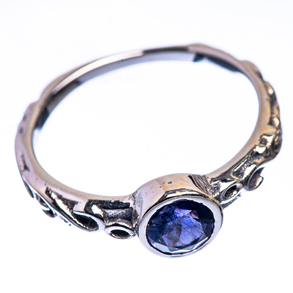 Sterling silver tanzanite dainty ring with oval blue gemstone bezel and carved side