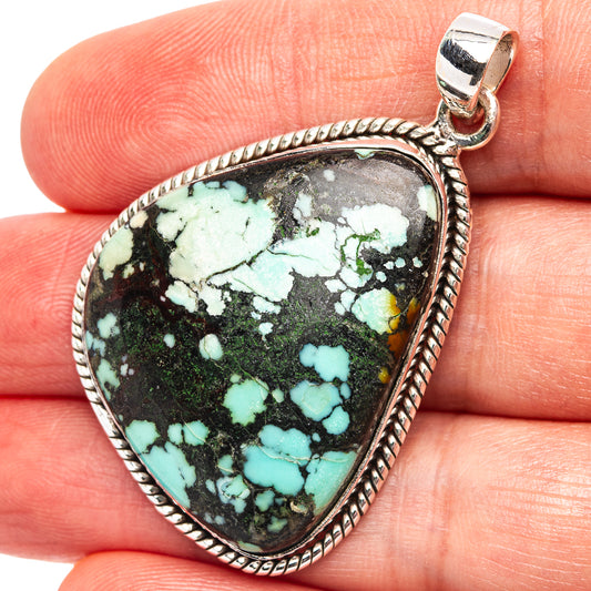 Sterling silver turquoise pendant, teardrop cabochon with rope border and bail