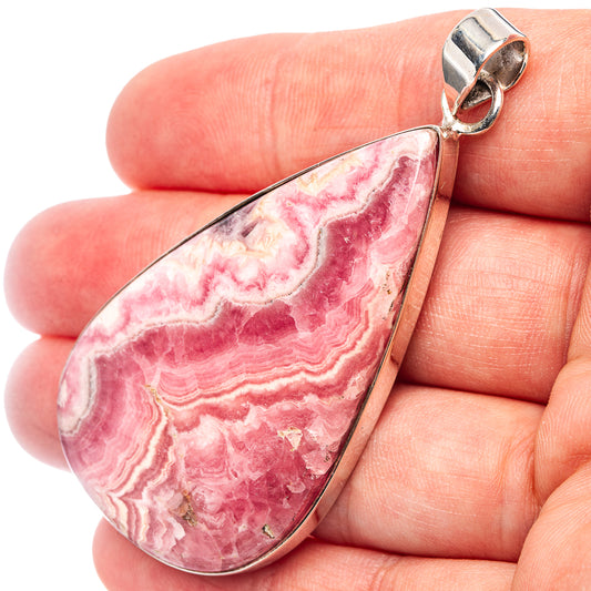 Rhodochrosite teardrop pendant in .925 sterling silver, close-up with bail