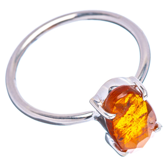 Orange kyanite ring with faceted oval amber gemstone and four-prong .925 sterling silver band