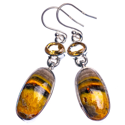 Sterling silver-tone long dangle earrings with oval bumble bee jasper and round yellow tops