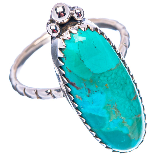Sterling silver turquoise ring with oval cabochon and scalloped bezel, ornate band