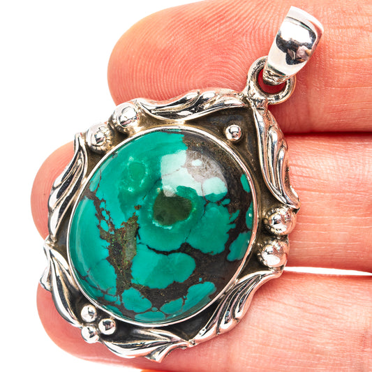 Turquoise cabochon pendant in .925 sterling silver with ornate bezel