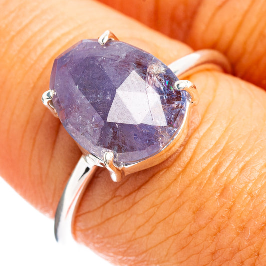 Faceted tanzanite ring with large oval stone, four-prong .925 sterling silver band