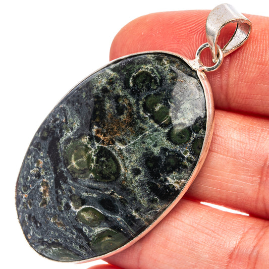 Silver-plated galaxy jasper teardrop pendant with blue-green mottled stone, bail top