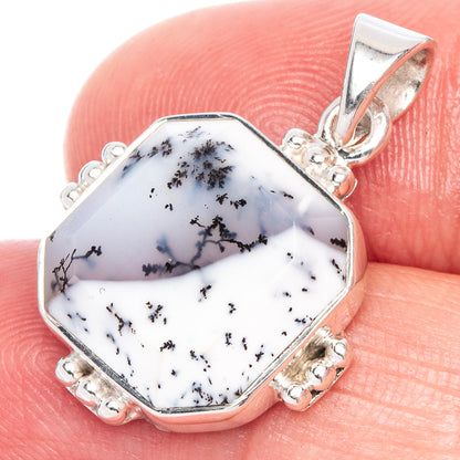 Octagonal dendritic opal pendant in sterling silver, shown held in hand