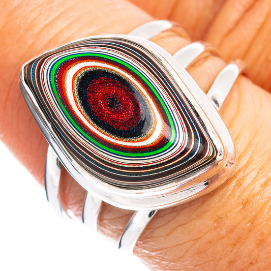 Oval fordite inlay sterling silver ring with concentric black, red, green, and white stripes