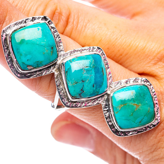 Oval turquoise three-stone ring in sterling silver, size 8, textured bezels.
