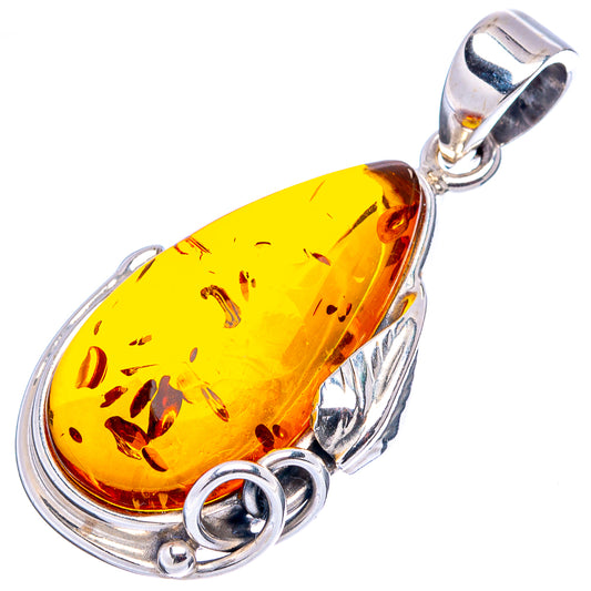 Oval honey amber pendant with speckled resin, .925 sterling silver setting and bail loop