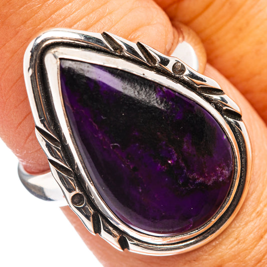 Sterling silver sugilite ring with large oval purple gemstone and ornate bezel