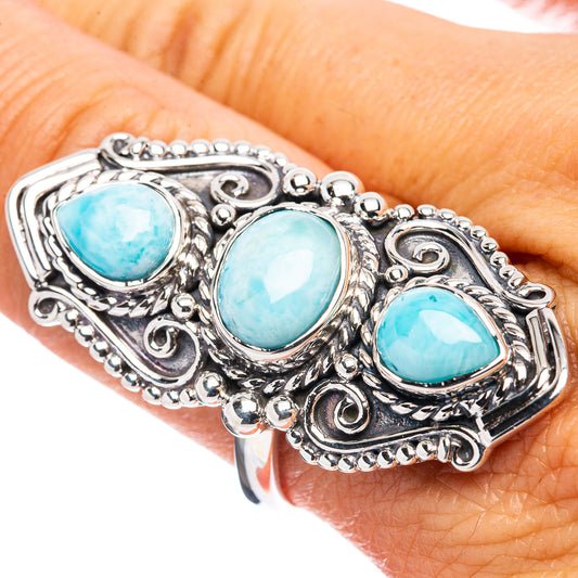 Sterling silver ring with three oval larimar-blue cabochons in ornate filigree setting