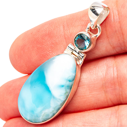 Oval blue larimar pendant with round blue topaz accent in sterling silver setting