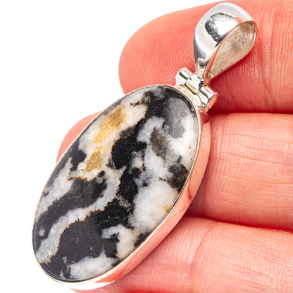 Oval White Buffalo Jasper pendant in .925 sterling silver bezel with bail