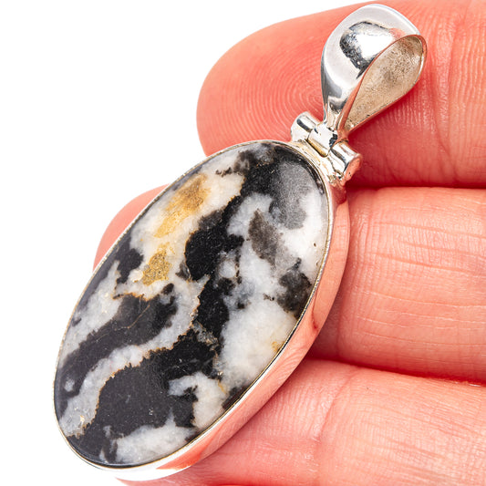 Oval White Buffalo Jasper pendant in .925 sterling silver bezel with bail