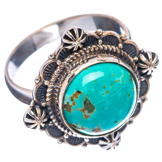 Turquoise oval silver ring featuring textured round setting and starburst accents