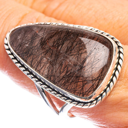 Sterling silver ring with oval tourmalinated quartz in rope-edged bezel, dark needles