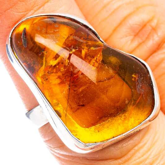 Oval Baltic amber cabochon ring, .925 sterling silver bezel, warm orange-yellow stone