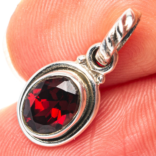 Garnet pendant in .925 sterling silver with round dark red gemstone, bail loop top
