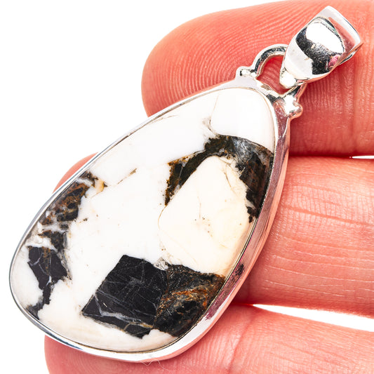 Sterling silver oval pendant with white and dark stone cabochon