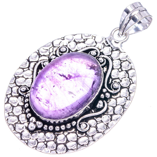 Amethyst oval pendant with bright purple cabochon and engraved silver-tone bezel