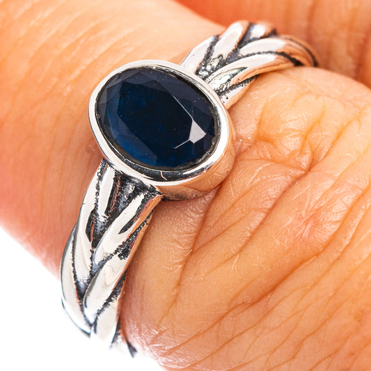Sterling silver dainty ring with oval dark blue quartz-style gemstone bezel