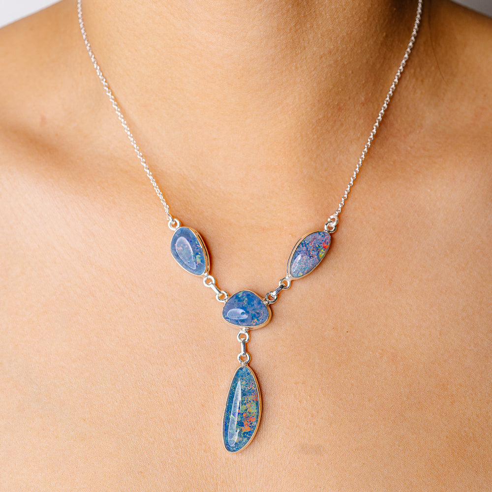 Triplet opal necklace with four teardrop pendants in blue opal, sterling silver chain