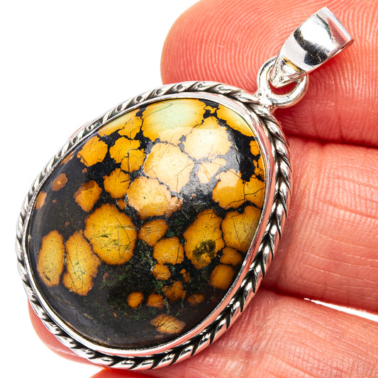 Oval sterling silver pendant with yellow-and-black stone mosaic cabochon, round bezel
