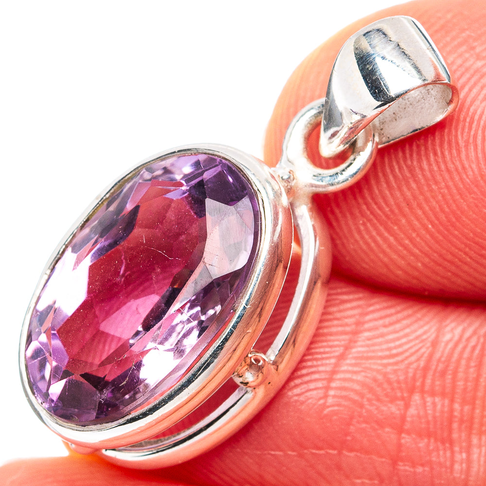 Oval faceted amethyst pendant in .925 sterling silver setting with hinged bail