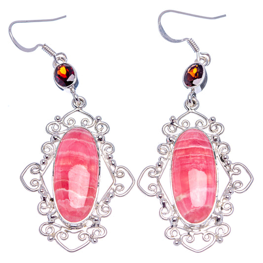 Pair of pink oval filigree drop earrings with dark red top stones and silver hooks