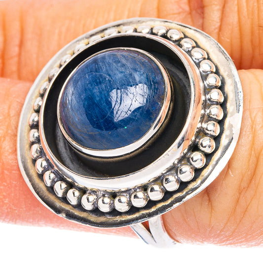 Sterling silver ring with oval blue kyanite cabochon, silver bezel and beaded border