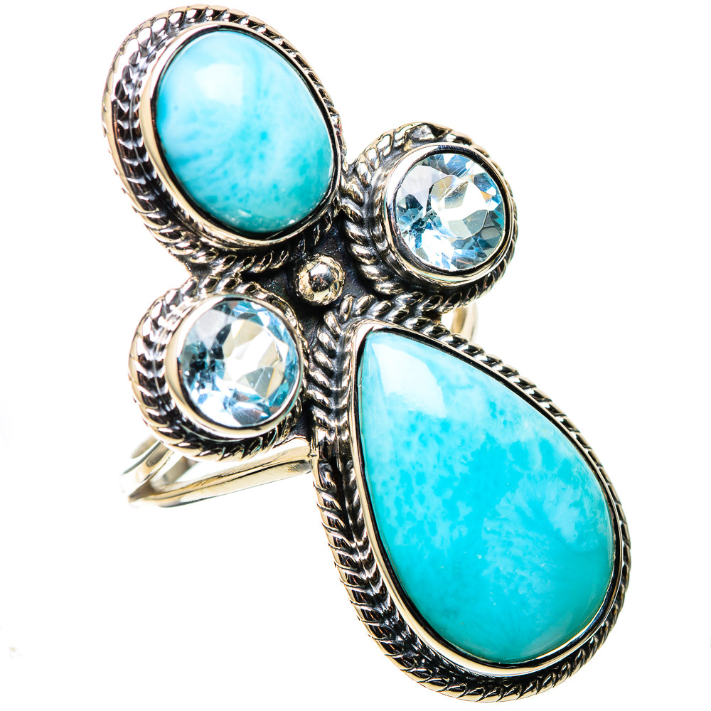 Silver statement ring with large oval turquoise stone and three blue round gemstones