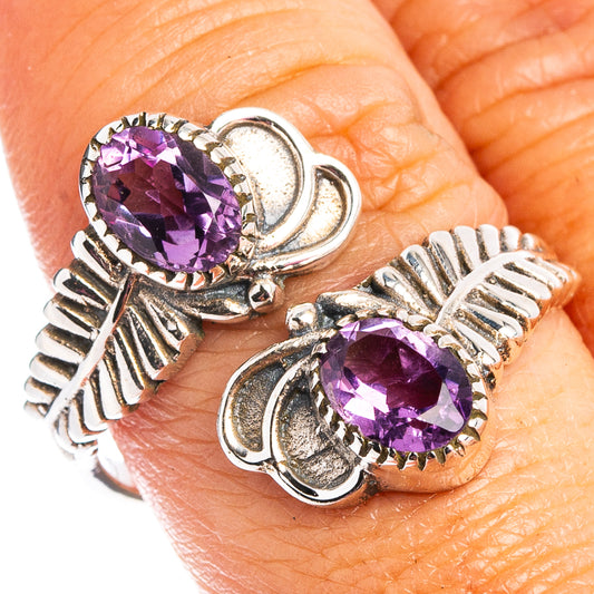 Sterling silver ring with faceted amethyst center stone and leaf-like accents