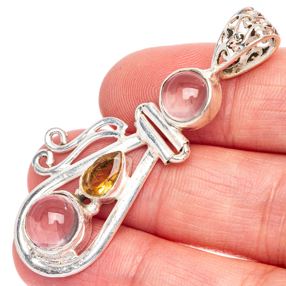 Rose quartz and citrine pendant with silver scrollwork and bail