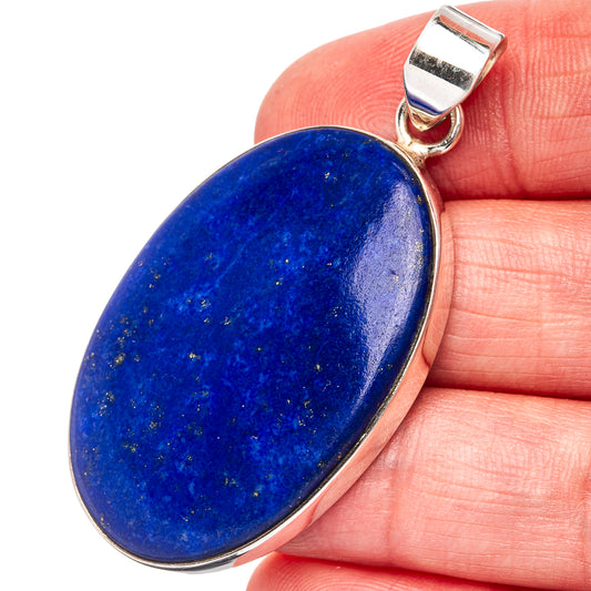 Lapis lazuli oval pendant in .925 sterling silver on finger