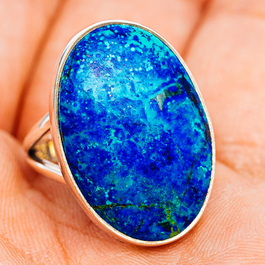 Oval blue azurite ring with sterling silver bezel and slim band, angled view