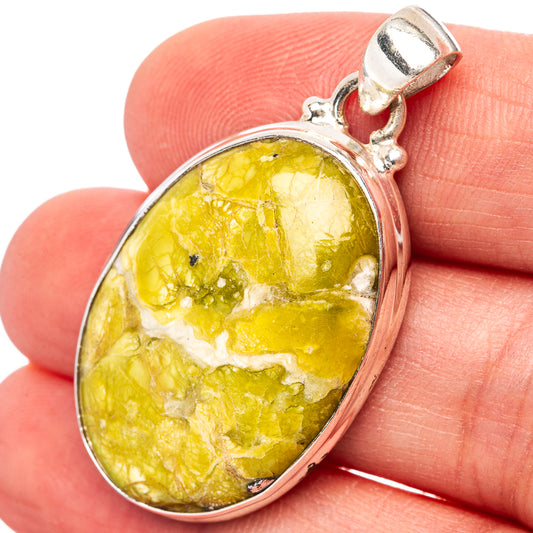 Oval yellow lizardite pendant in .925 sterling silver bezel, with top bail.