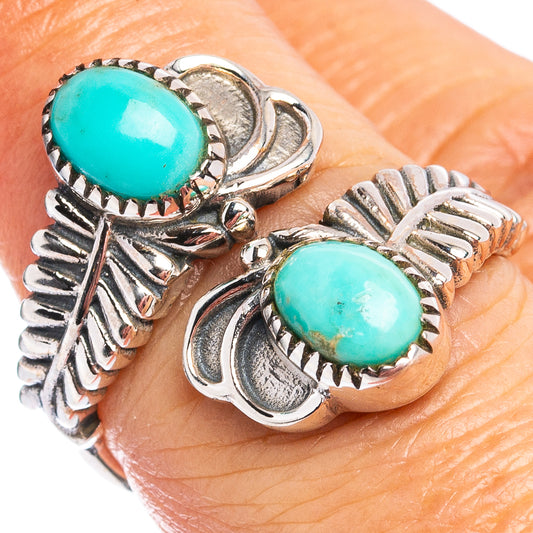 Turquoise cabochon sterling silver ring with ornate leaf and sunburst settings