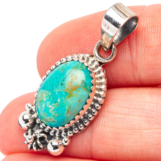 Turquoise oval pendant on .925 sterling silver bail, ornate beadwork frame