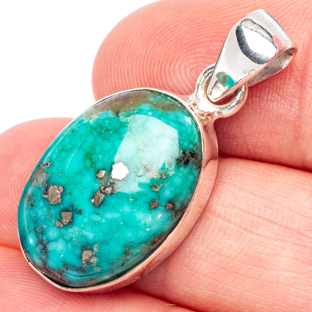 Oval Persian turquoise gemstone pendant in 925 sterling silver bezel, bail loop top