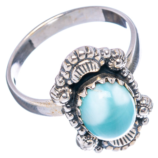 Side view of sterling silver ring with oval light blue larimar and raised ornate setting
