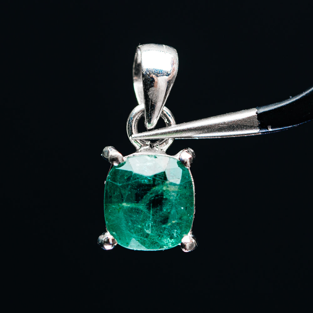 Sterling silver pendant with faceted emerald-green stone and four prongs