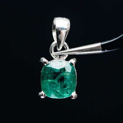 Sterling silver pendant with faceted emerald-green stone and four prongs