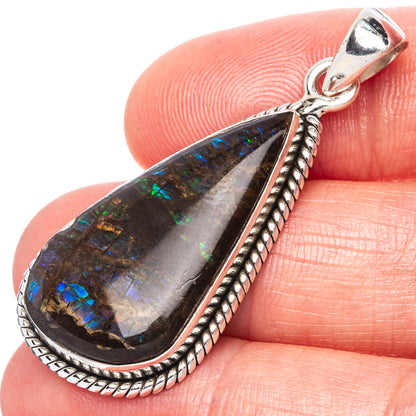 Sterling silver ammolite teardrop pendant with blue-green iridescent stone detail