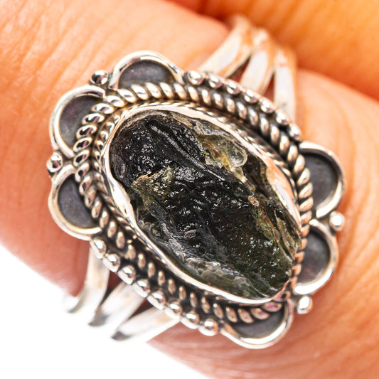 Sterling silver moldavite ring with oval dark green-black stone, rope bezel setting